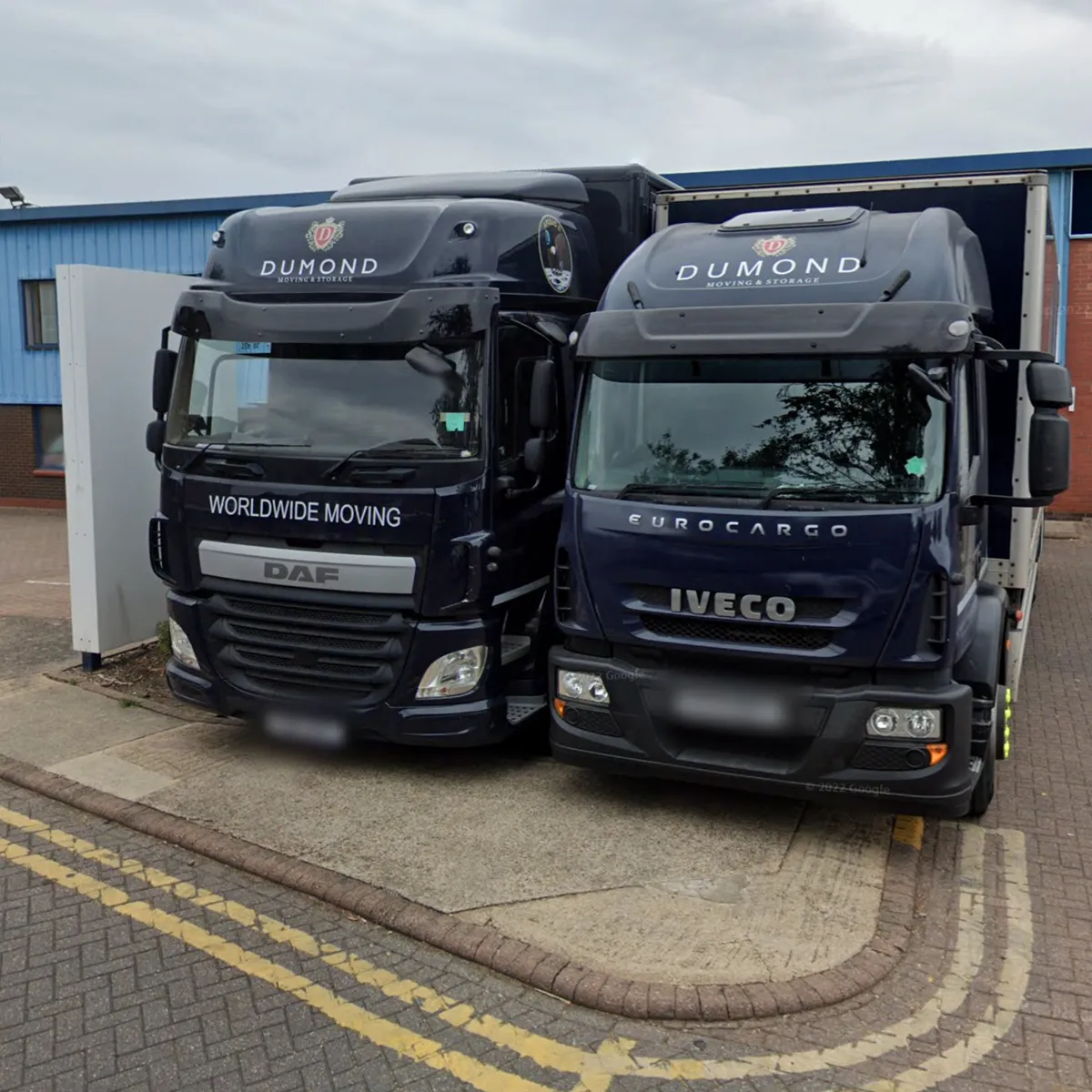 two Dumond vans outside their premises