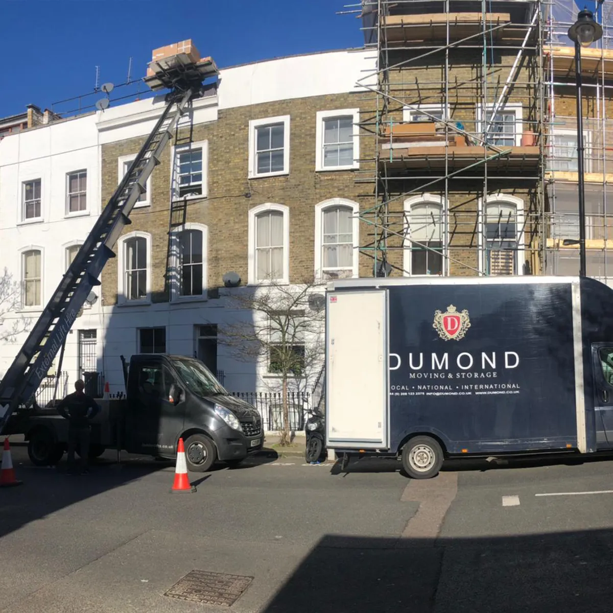 Specialist ladder lift delivering items to an upper-floor property with restricted access.