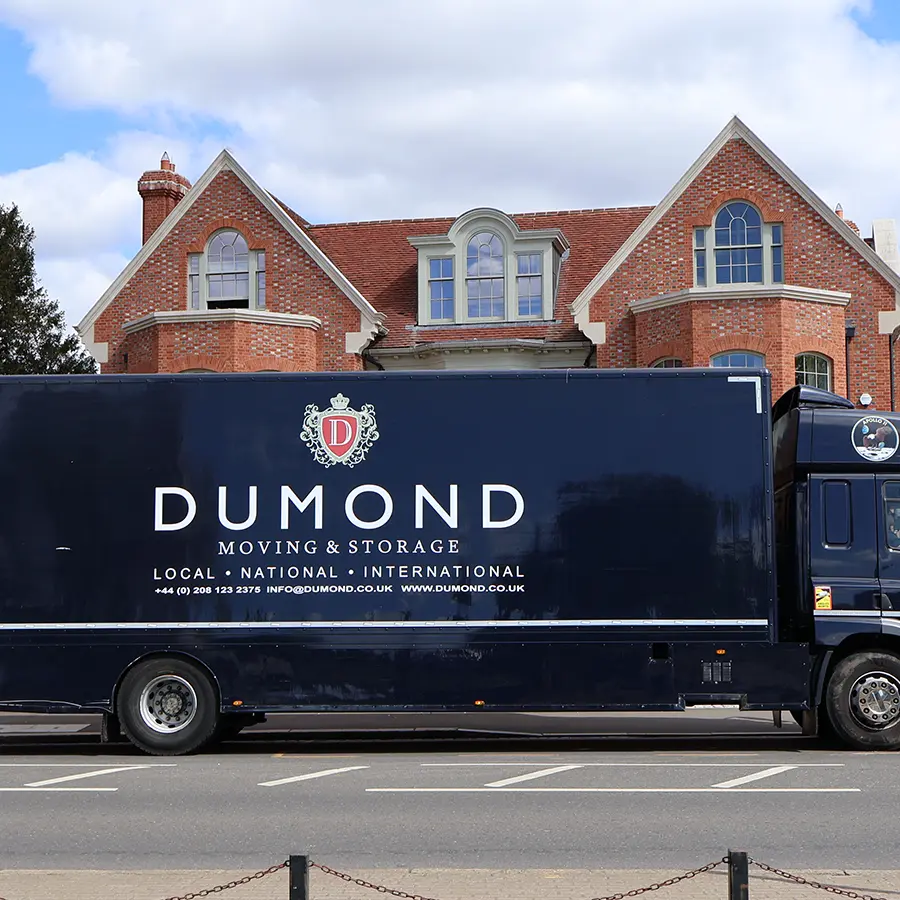 Dumond removals van outside a residential property for an international move.