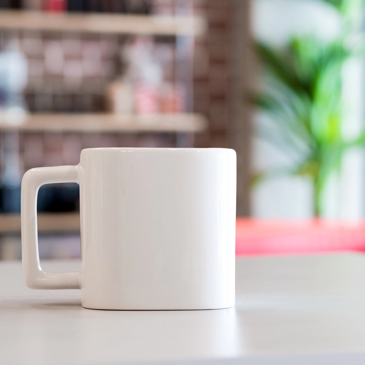A close-up of a mug of tea on an office desk