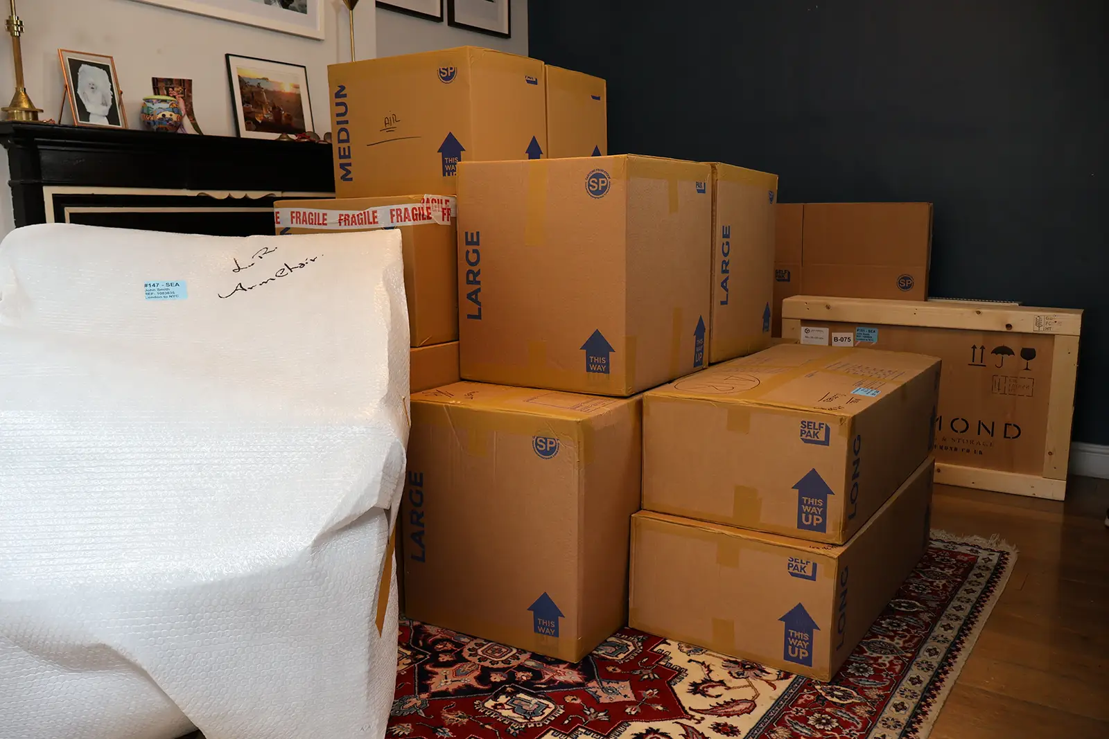 Packed moving boxes stacked inside a home ready for relocation.
