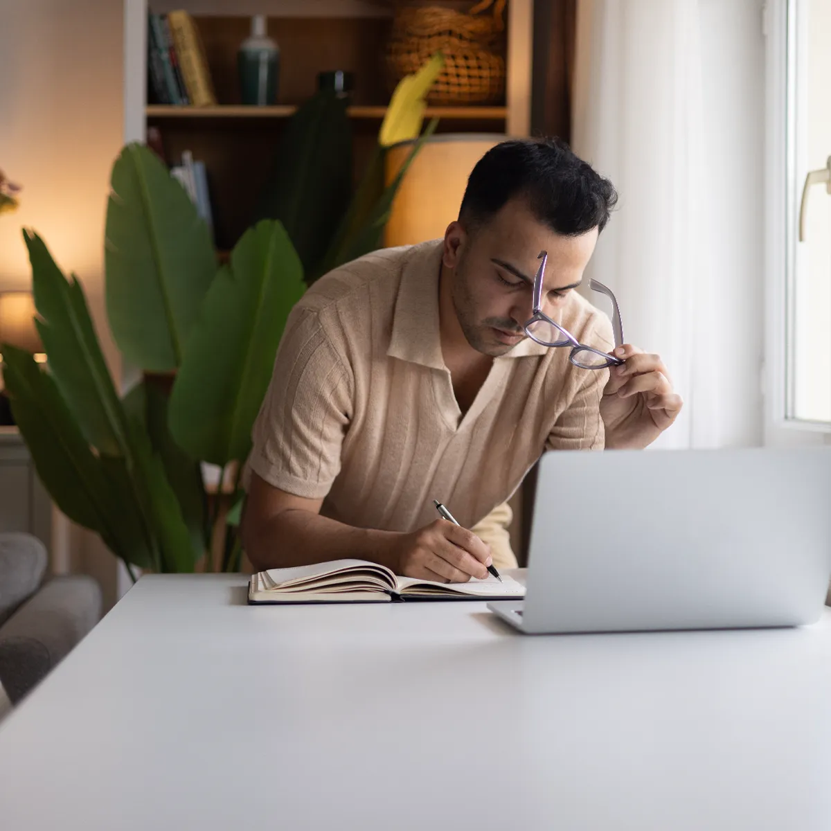 Man working on a computer at home